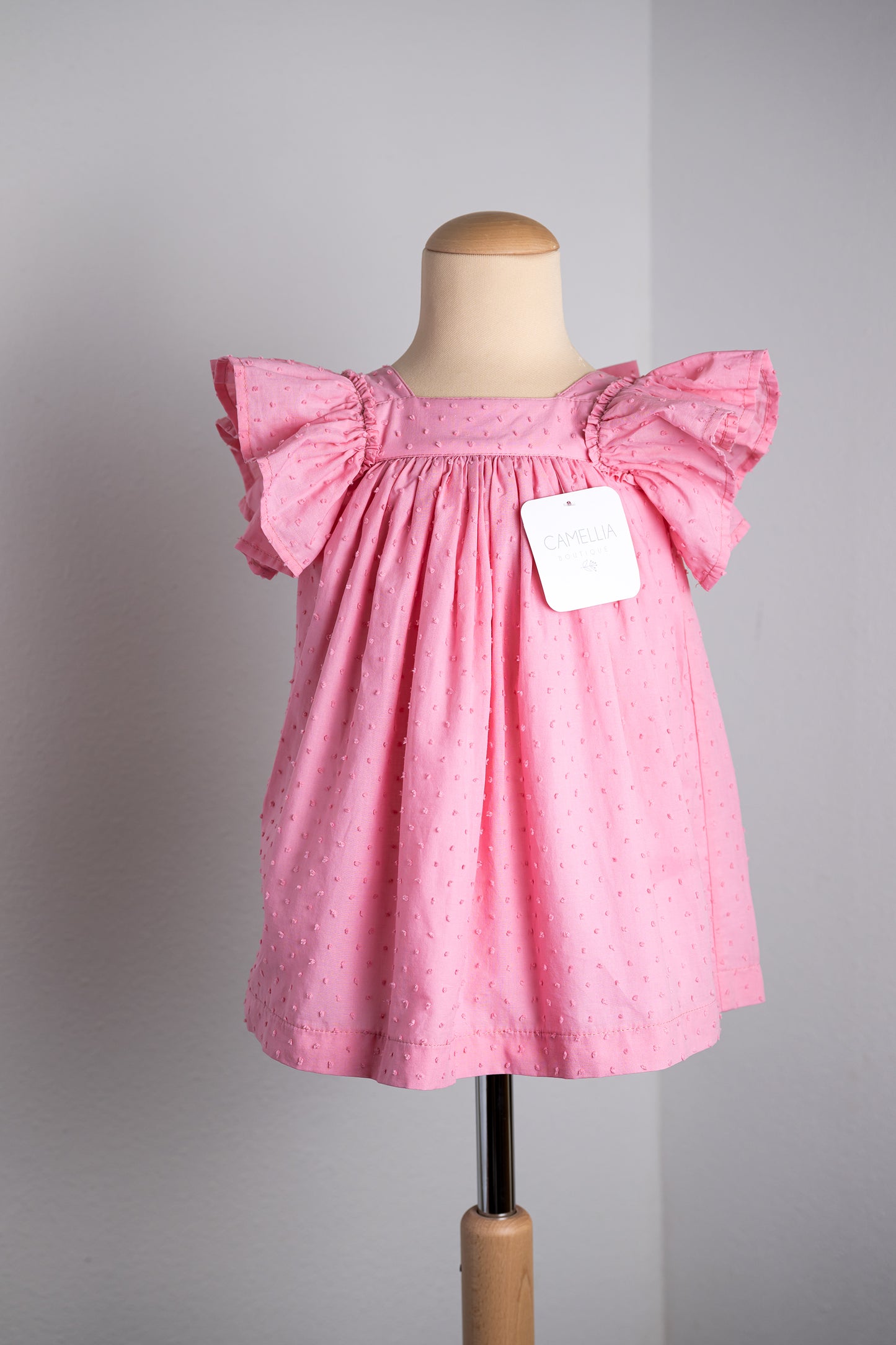 Roze jurk met grote roze strik